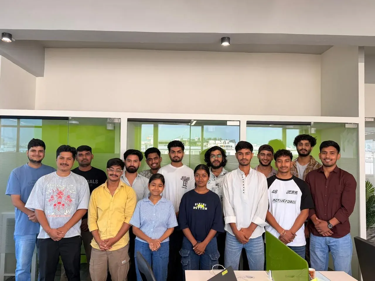 A team of CodeYogi students together at the office where they were hired